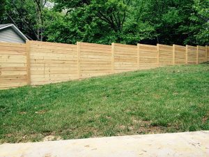 How a Wood Fence is Installed on a Sloping Lot
